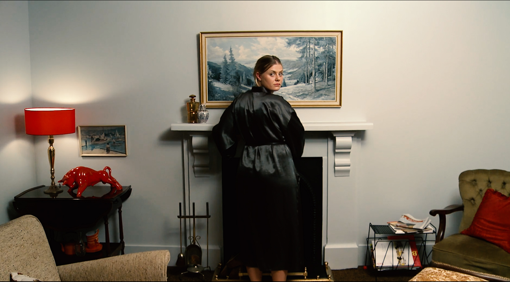 image of a woman in front of a fireplace